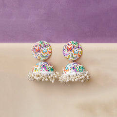 Multicolor butterfly print dome jhumka earrings with pearl cluster fringe detailing. White base with vibrant butterfly motifs in pink, blue, and yellow tones. Lightweight statement earrings perfect for festive and ethnic wear styling.