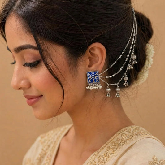 Royal blue enamel earchains with intricate silver detailing, pearl strands, and cascading charms, designed in a traditional statement style for festive and bridal wear.