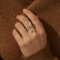 18K gold plated double butterfly wrap ring with clear cubic zirconia paved butterflies and band. The open adjustable design features two detailed butterfly motifs for a whimsical look. Perfect feminine demi-fine ring for daily or party wear.