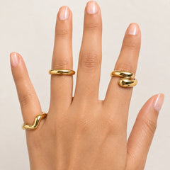 "3-piece gold statement ring
combo featuring smooth organic wave designs with a polished gold-tone finish. A minimalist stackable ring set for women, perfect for everyday wear, modern styling, casual outfits, and special occasions."