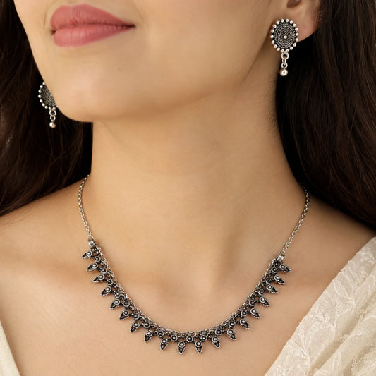 Oxidised silver rava work stud earrings with bead drops from choker set
