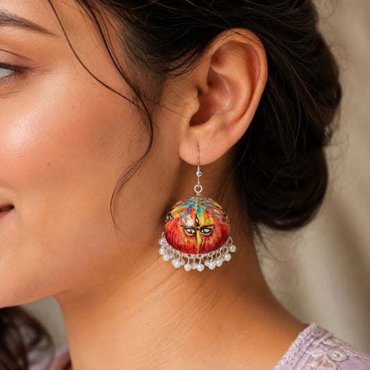 Handcrafted Ma Durga Meenakari earrings featuring a vibrant hand-painted Maa Durga eye motif on a multicolored dome with delicate white pearl bead drops. Traditional ethnic earrings for women, perfect for Navratri, Durga Puja, festive celebrations, weddings, and Indian ethnic wear.