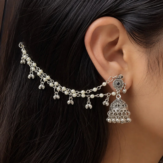 "Oxidised silver-tone long chain
jhumka earrings with intricate filigree dome design, pearl chain detailing, and dangling ghungroo bells. Traditional statement earrings for women, perfect for weddings, festive celebrations, Navratri, Haldi, Mehendi, cultural events, and Indo-western styling."