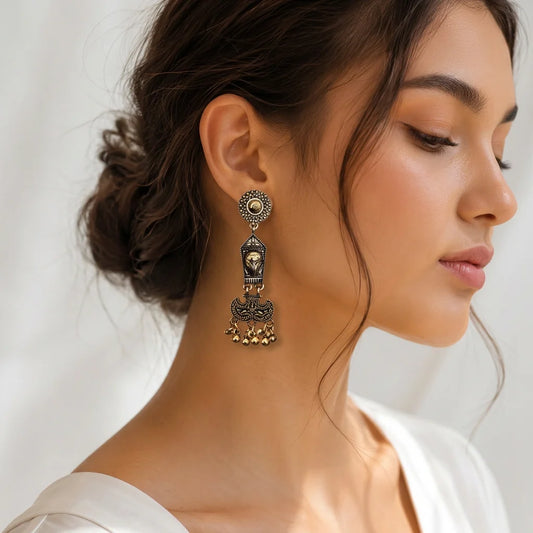 "Pair of antique gold-tone
statement earrings with intricate circular studs, elongated traditional ornamental drops, and clusters of dangling golden bead charms."