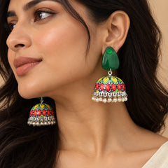 Green floral Meenakari jhumka earrings with glossy green tops, multicolour floral dome designs, silver-tone detailing, and dangling pearl charms.