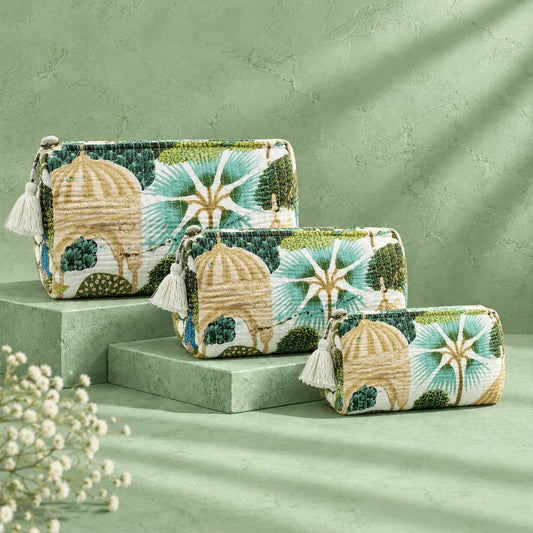 "Set of quilted fabric
pouches in green, cream, and beige, featuring botanical foliage, leafy patterns, and colorful peacock motifs."