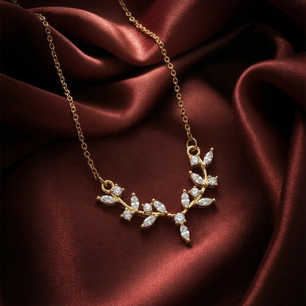 18K gold plated leaf vine demi-fine necklace with clear cubic zirconia stones. 18K gold minimalist V-shaped leaf pendant necklace for women.