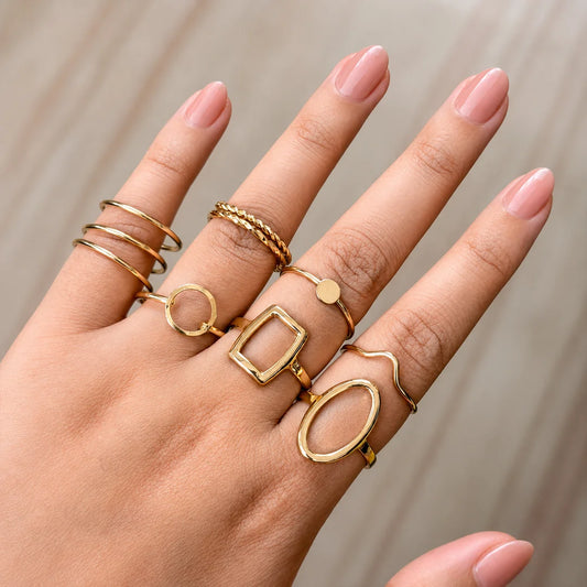 "Golden ring combo for women
featuring minimalist, geometric and textured stacking rings in assorted modern designs."