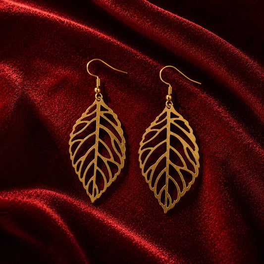 Gold leaf dangle earrings with cutwork vein design. Lightweight gold-plated fish-hook earrings with leaf silhouette. Minimal western jewelry for daily and office wear.