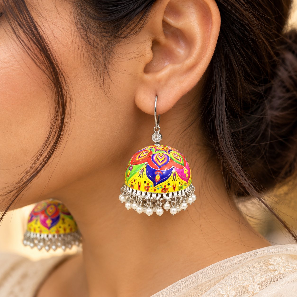 Multicolour Rangoli Meenakari jhumka earrings featuring vibrant rangoli-inspired motifs, dome-shaped designs, and silver-tone dangling ghungroo details.