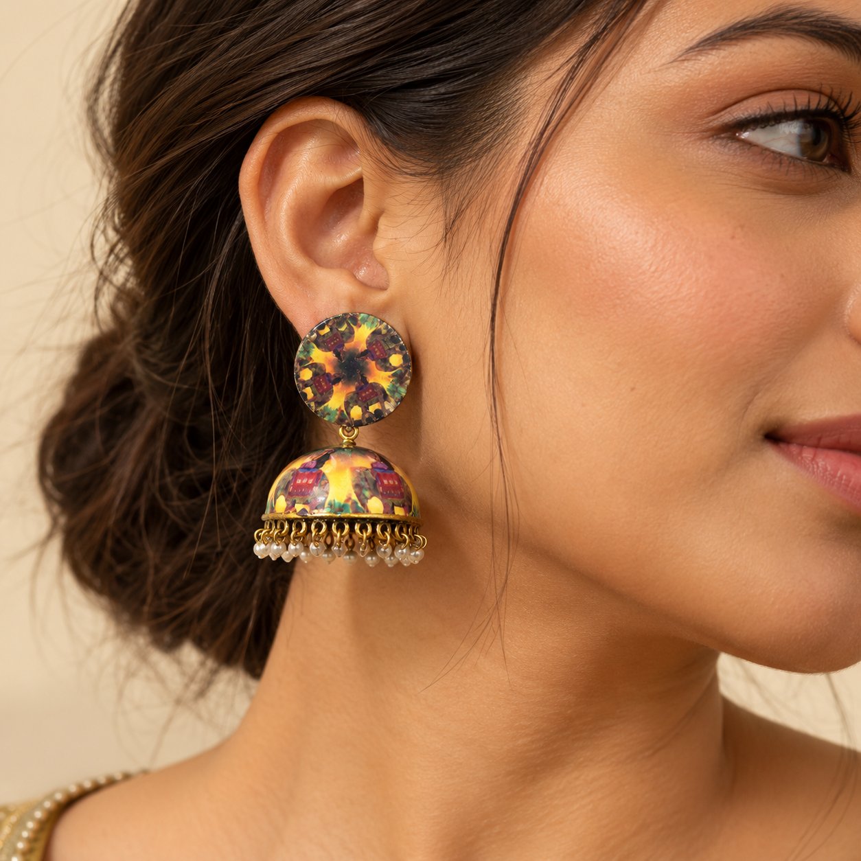 Multicolour printed jhumka earrings with matching round tops, vibrant patterned dome drops, antique gold-tone detailing, and dangling pearl charms.