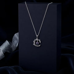 Silver-tone leaf pendant necklace with a shimmering lavender crystal centerpiece, suspended from a delicate silver chain. Elegant and lightweight women's fashion jewellery for everyday and occasion wear.