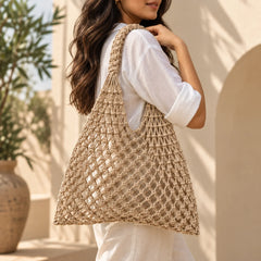 Beige mesh crochet  bag with an open-weave knotted design and a relaxed, lightweight silhouette.
