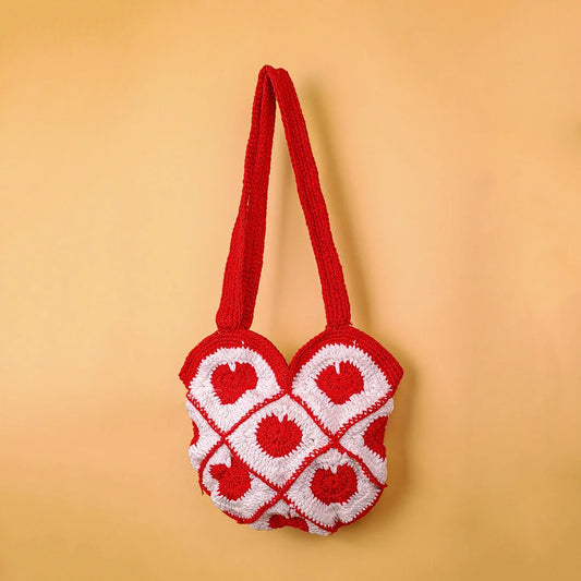  Handmade crochet bag with maroon‑white diamond grid and red heart motifs. Soft, sturdy, and perfect for everyday use. Stylish accessory for casual outings.