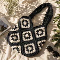 "Handcrafted black and 
white crochet bag featuring a classic granny square pattern, spacious design, and sturdy crochet shoulder straps. A stylish boho-inspired handbag for everyday use, shopping, beach outings, travel, and casual wear."
