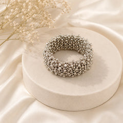Oxidised silver spiral bracelet with tiny beads. Flexible coil wrap bracelet in antique silver finish. Tribal boho arm jewellery.
