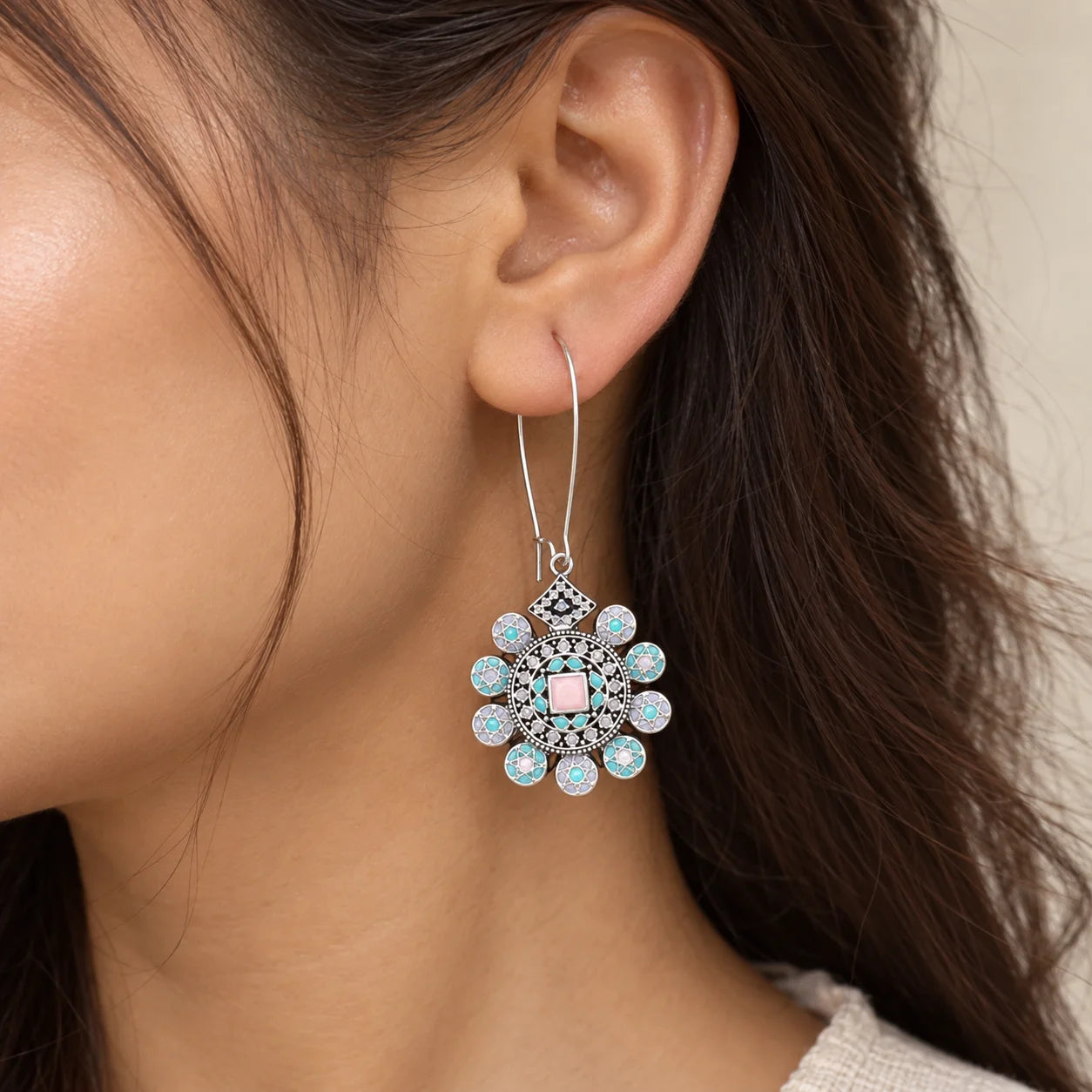 "Pair of antique gold-tone 
statement earrings with intricate circular studs, elongated traditional ornamental drops, and clusters of dangling golden bead charms."
