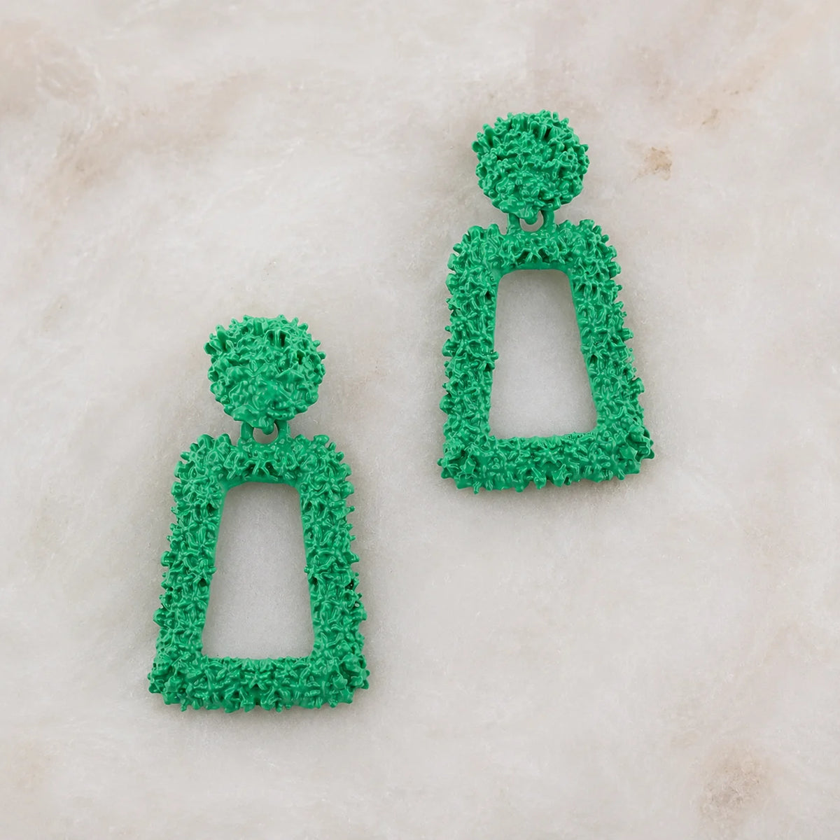 Bright green geometric earrings with textured coating. Round top and hollow rectangle drop with post-back closure. Y2K western statement jewelry.
