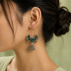 Traditional green enamel baali jhumka earrings. Silver-tone hoops with green enamel discs, ghungroos and jhumka drop. Ethnic jewelry for women.
