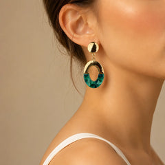 Gold-tone oval earrings with green marble acrylic. Half-moon green inlay with gold top and chain connector. Western demi-fine statement earrings.
