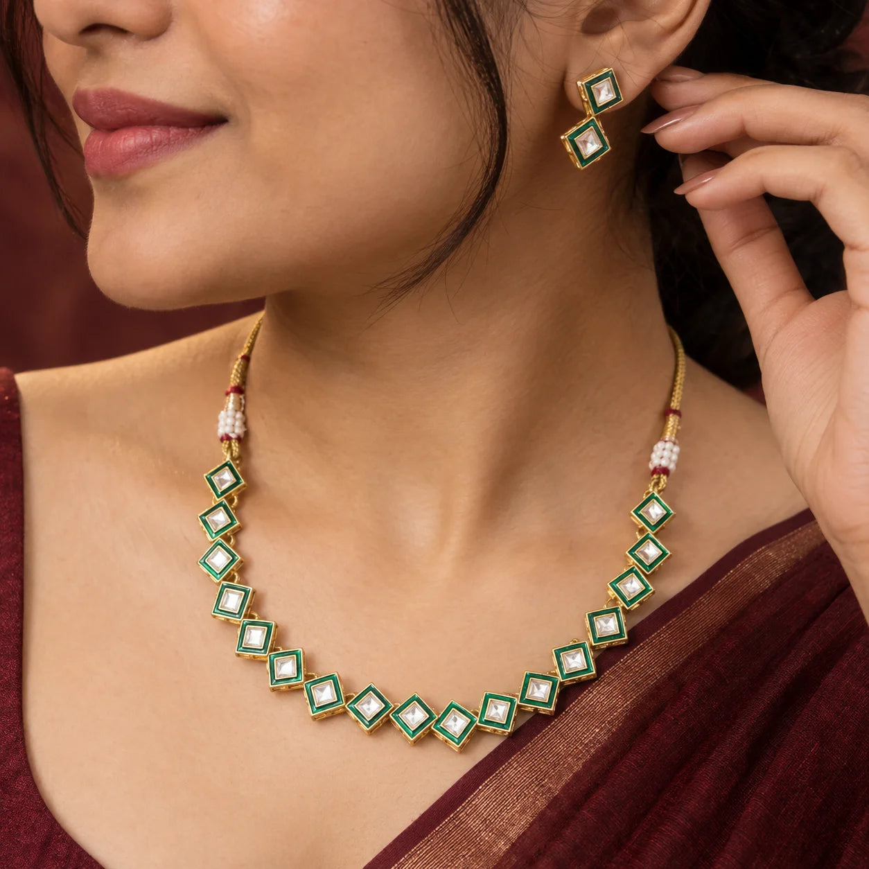 Green kundan square necklace set with geometric stones, gold-toned detailing, and matching square kundan earrings.
