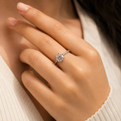 "Silver-tone solitaire ring 
featuring a brilliant round-cut crystal center stone with a sleek band, designed as an elegant statement ring for women, perfect for everyday wear and special occasions."
