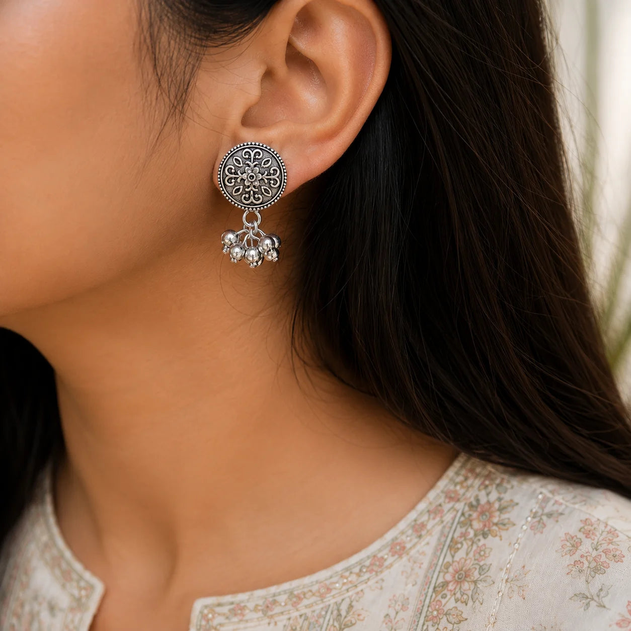 Oxidised floral coin stud earrings with ghungroo. Round embossed silver studs with beaded border and dangling drops. Office wear ethnic accessory.Option 3
