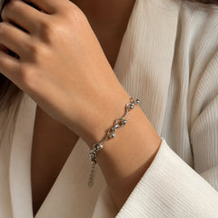 Demi-fine 925 silver plated wave link bracelet with ball details on wood. Silver tone adjustable bracelet with extension chain and lobster clasp. Modern minimalist wrist bracelet for women with high-polish finish.
