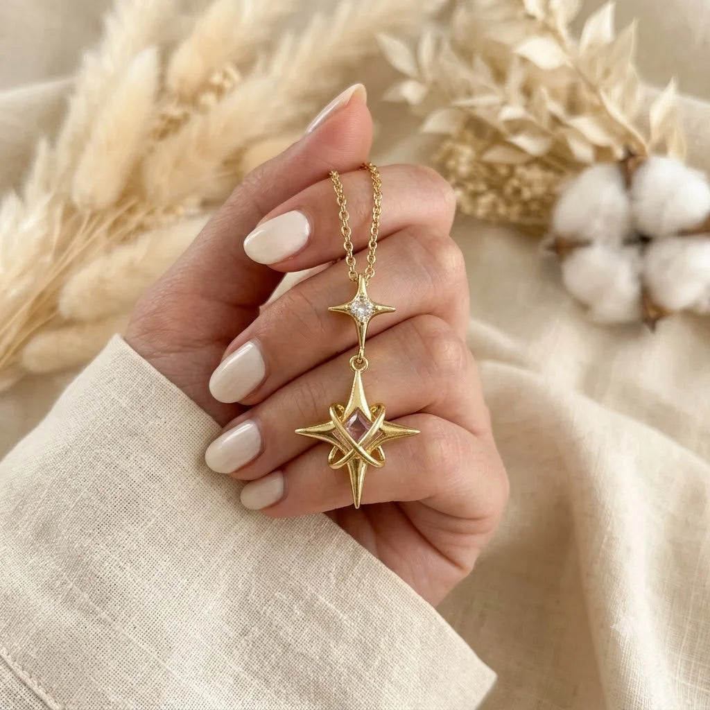 18K gold plated starburst necklace with purple gemstone and clear cubic zirconia on a delicate gold chain. Perfect celestial demi-fine jewelry for women.

