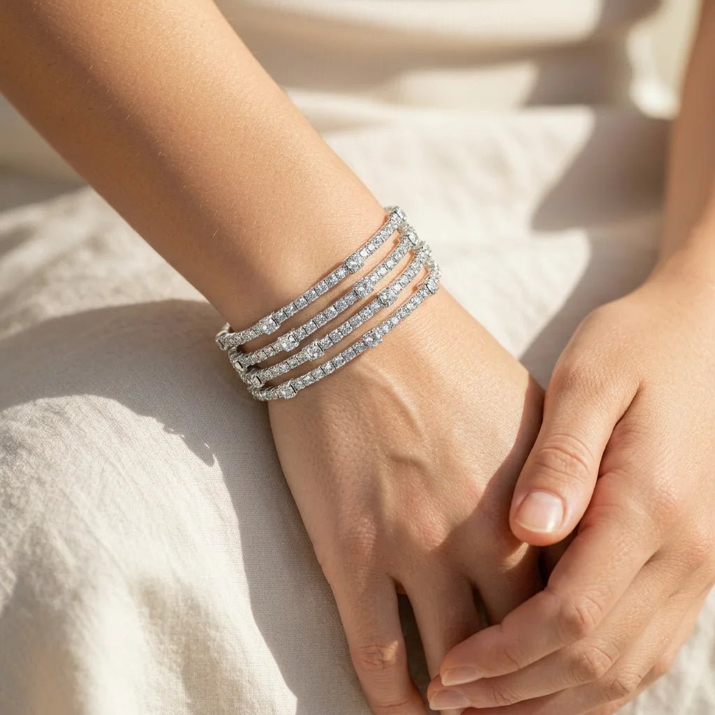 Contemporary rhodium plated multi-coil bracelet with full crystal pavé for maximum shine. Lightweight nickel-free brass makes it comfortable for sensitive skin. A western glam bangle that works solo or for layering.
