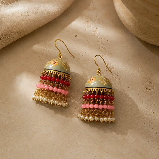 Sage grey enamel dome jhumkas with bead fringe. Handpainted floral dome with layered pearls and beads. Traditional festive earrings.

