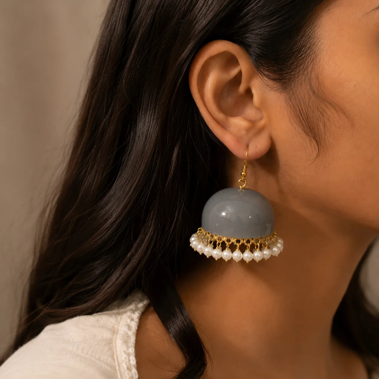 rey dome pearl drop earrings. Gold-tone earrings with glossy grey enamel and white pearl fringe. Fusion jewelry for women.
