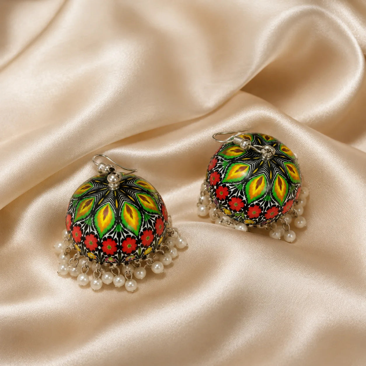 Printed enamel jhumka earrings with pearl drops. Colorful floral dome with silver base. Traditional festive earrings.
