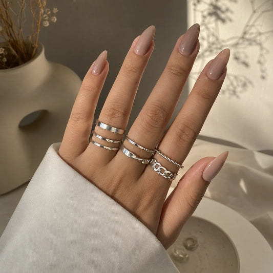 "Silver ring combo for women 
featuring six minimalist, twisted and textured stackable rings in modern designs."
