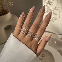 "Silver ring combo for women 
featuring six minimalist, twisted and textured stackable rings in modern designs."
