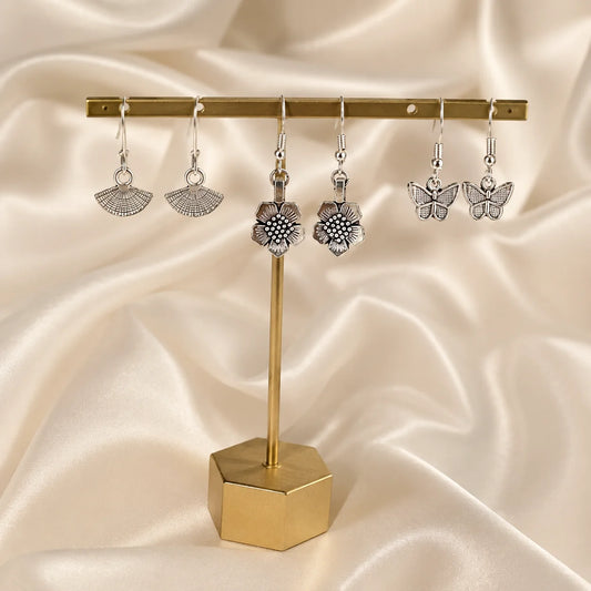 Set of 3 oxidised silver earring pairs. Small fan motif hooks, butterfly hooks, and flower drop hook earrings. Antique silver daily wear combo.
