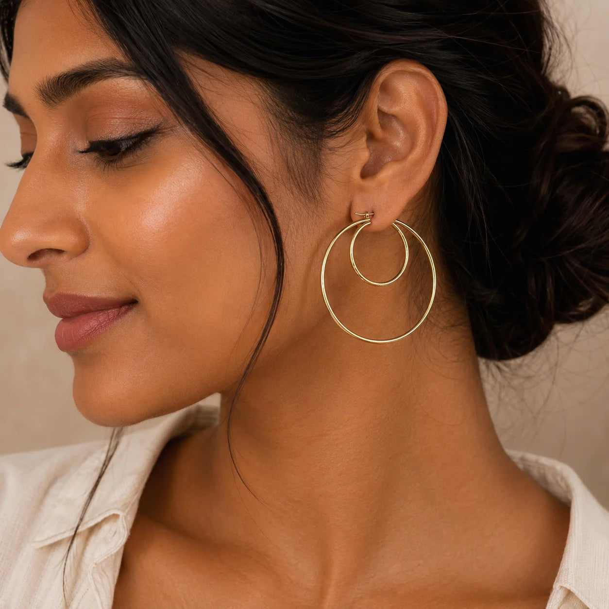 Large textured gold hoop earrings featuring an engraved pattern with a polished gold-tone finish. Lightweight statement hoop earrings for women, perfect for everyday wear, vacations, and festive occasions.
