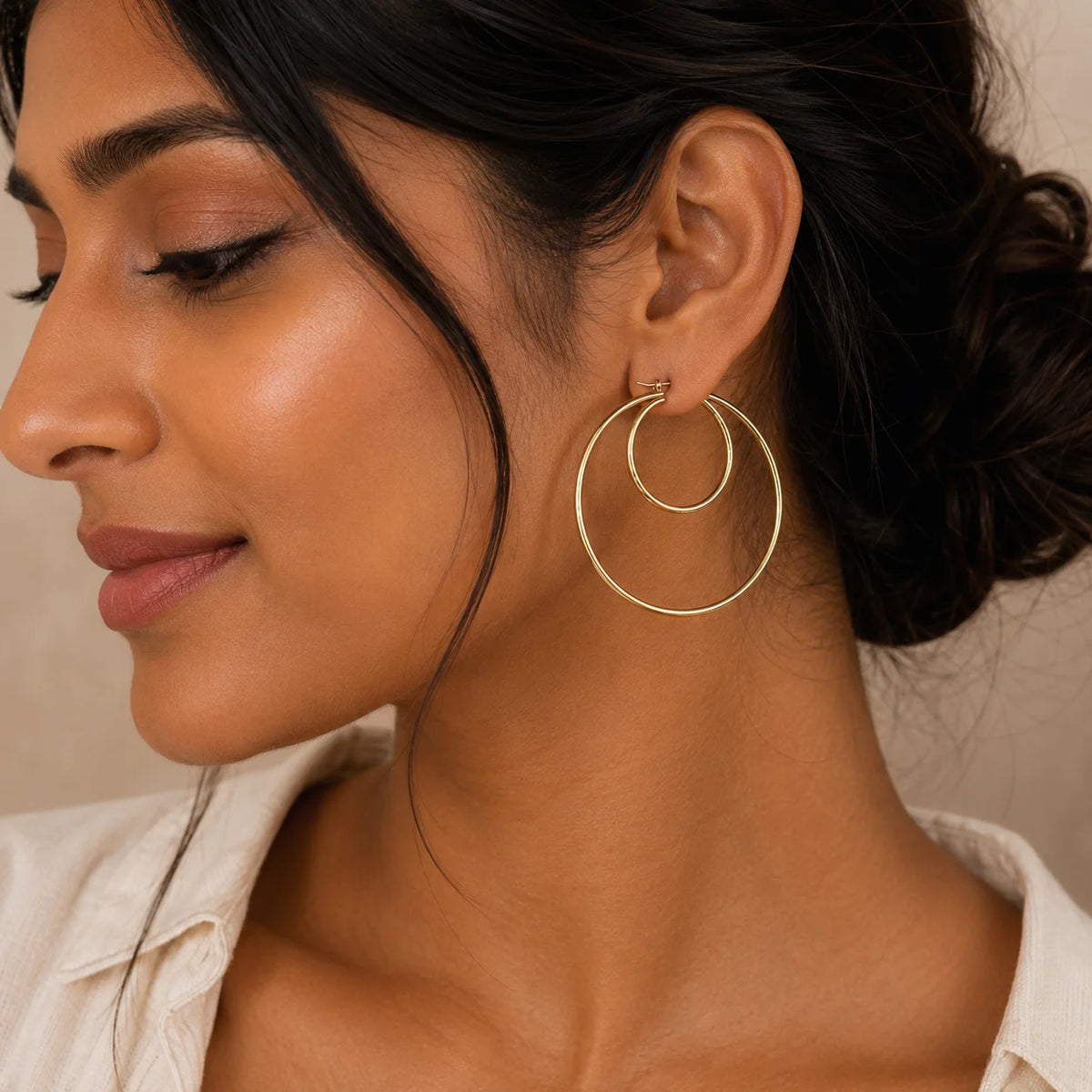Large textured gold hoop earrings featuring an engraved pattern with a polished gold-tone finish. Lightweight statement hoop earrings for women, perfect for everyday wear, vacations, and festive occasions.
