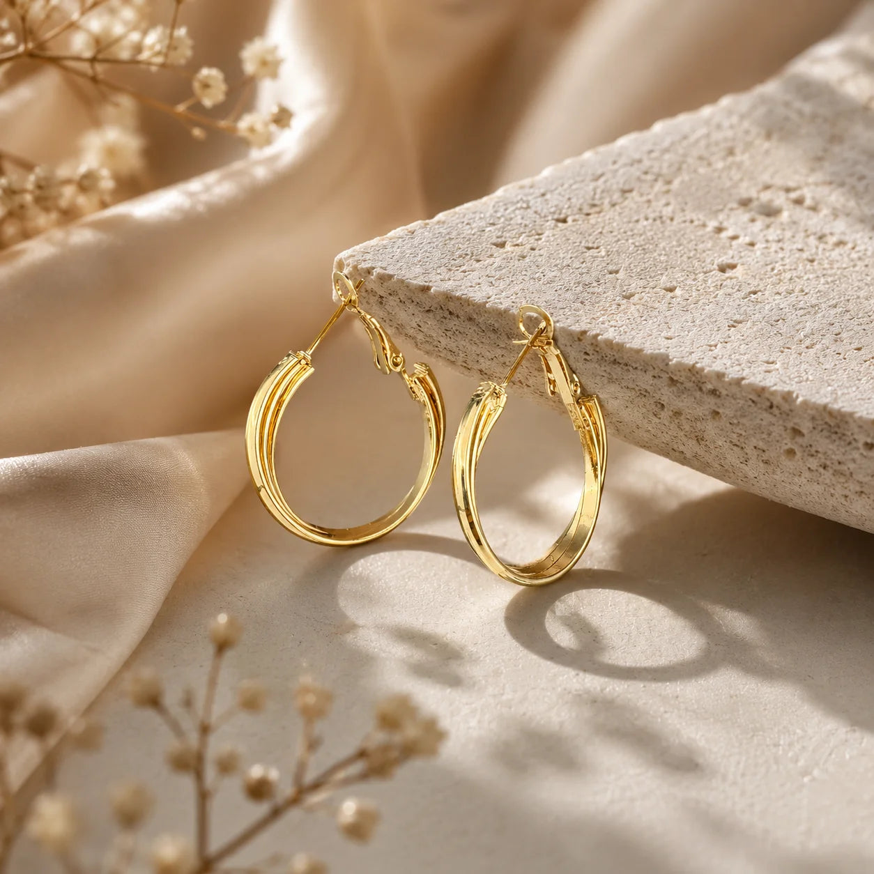 "Triple layer gold hoop earrings
 featuring a sleek polished
 finish and contemporary 
layered band design.
 Lightweight statement hoop 
earrings for women, perfect
 for everyday wear, office,
 parties, and special occasions."

