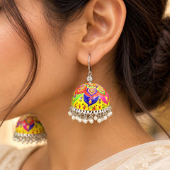 Multicolour Rangoli Meenakari jhumka earrings featuring vibrant rangoli-inspired motifs, dome-shaped designs, and silver-tone dangling ghungroo details.
