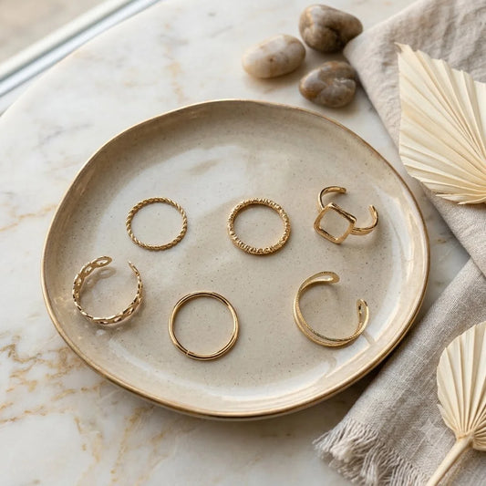 Gold plated ring combo set with 6 assorted geometric designs including twisted rope and open square rings. Minimal stacking rings for office wear.
