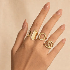 "Gold statement ring combo 
featuring three contemporary open rings with  sculptural designs and a polished finish, perfect for stacking or wearing individually for a modern everyday look."

