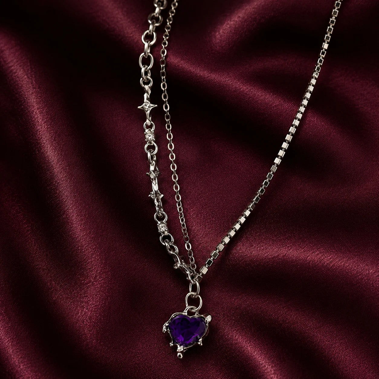 "Silver-tone layered 
necklace featuring sparkling rhinestone chains, star-link detailing, and a purple heart crystal 
pendant. Trendy Y2K-inspiredstatement jewellery for women, perfect for parties,
 concerts, and everyday fashion."
