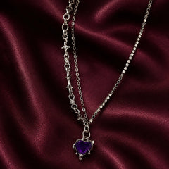 "Silver-tone layered 
necklace featuring sparkling rhinestone chains, star-link detailing, and a purple heart crystal 
pendant. Trendy Y2K-inspiredstatement jewellery for women, perfect for parties,
 concerts, and everyday fashion."
