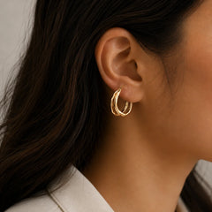 "Organic gold hoop earrings 
featuring a sculpted open
 hoop design with a textured 
hammered finish. Lightweight
 minimalist earrings for
 women, perfect for everyday 
wear, office, parties, 
and festive occasions."
