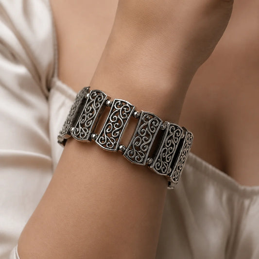  Oxidised silver adjustable bracelet with filigree panels and ghungroo charm for women
