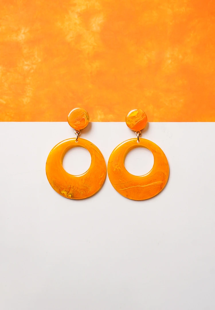 108-Th Chic metal hoop earrings featuring a wooden beads and a latch back for easy wear.