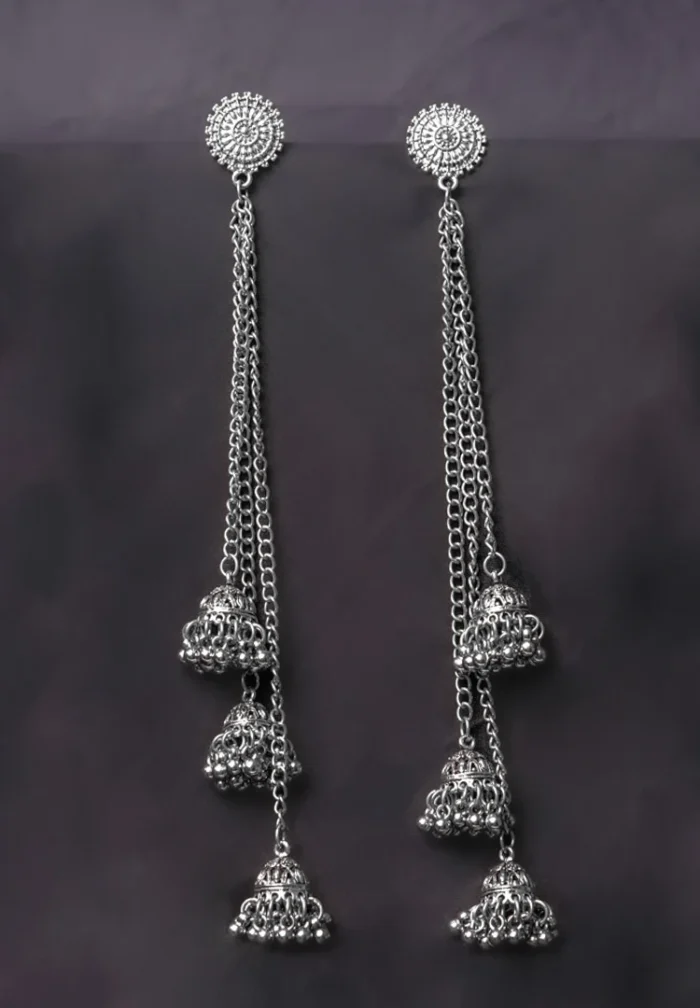 Unique flower-shaped brass earrings with a dimensional dome structure, fine hammered detailing, and an easy-to-wear curved hook.