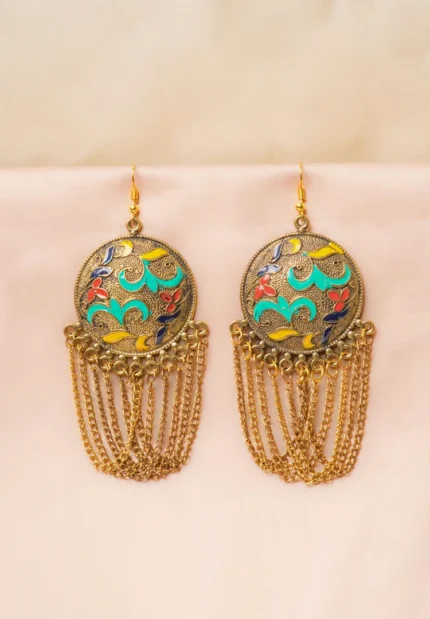 Handcrafted metal dangle earrings featuring a floral detailing and oxidised gold-tone finish designed with interconnected chain tassels secured with a curved hook closure.