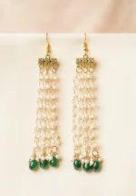 Statement gold tassel earrings featuring a delicately engraved rectangular bar design, fluid chain tassels for an elegant floral effect and designed with evenly spaced small pearl beads, a oval green colored circular shaped beads at the end and a curved hook closure